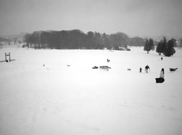 Airborn-Sledding-during-the-second-snow-storm-of-the-week-at-Payson-Park-in-Back-Cove-in-Portland,-Maine.-(P1100408)