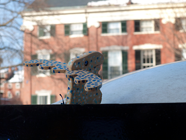 Moose-toy-on-bus-stop-kiosk,-State-Street,-Portland,-Maine-(P1110786)